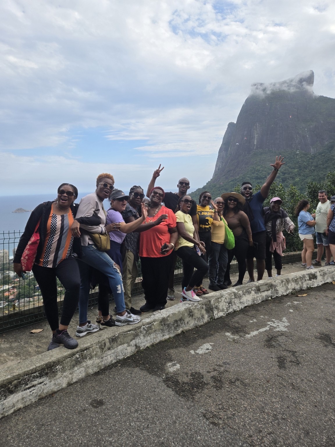 Travelers gathered at a mountain overlook in Brazil