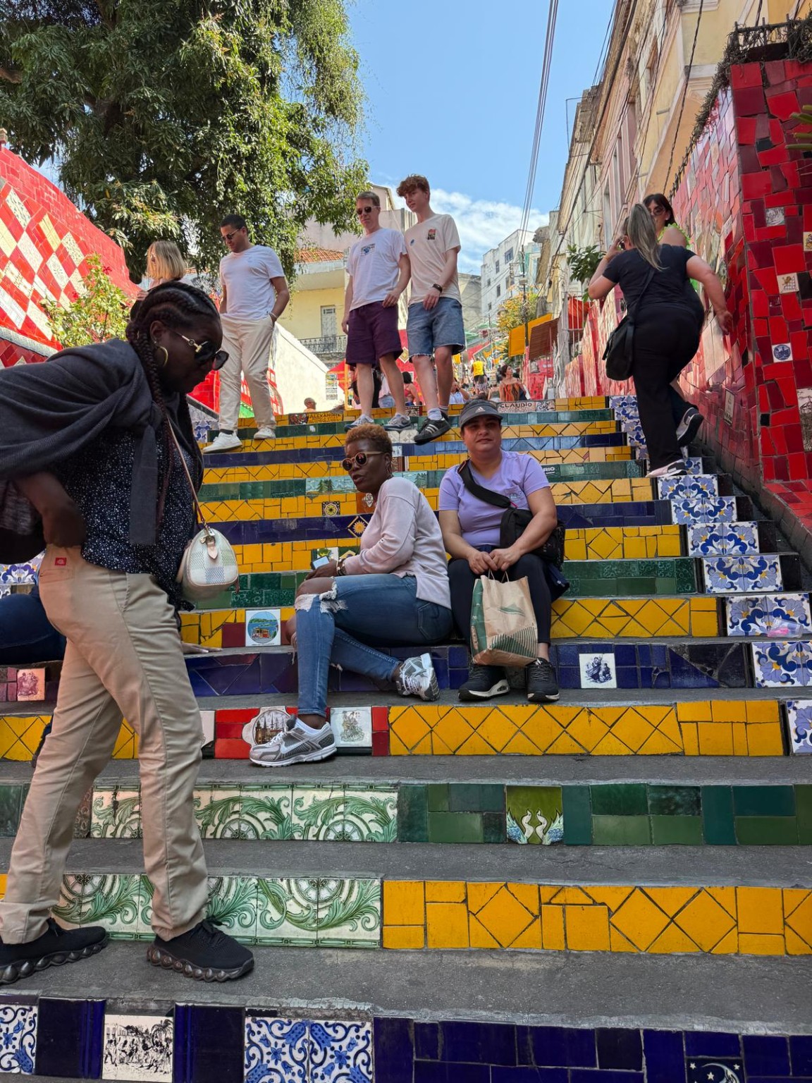 Travelers on colorful tiled steps in Brazil